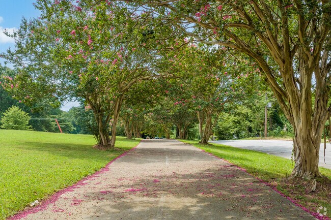 Residents can enjoy walks under canopies of Crepe Myrtle tree blooms at Ella Mae Memorial Park in Hunter Hills.