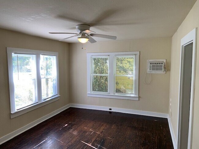 Building Photo - *COMING SOON* Charming Cottage Retreat with Fenced Yard!