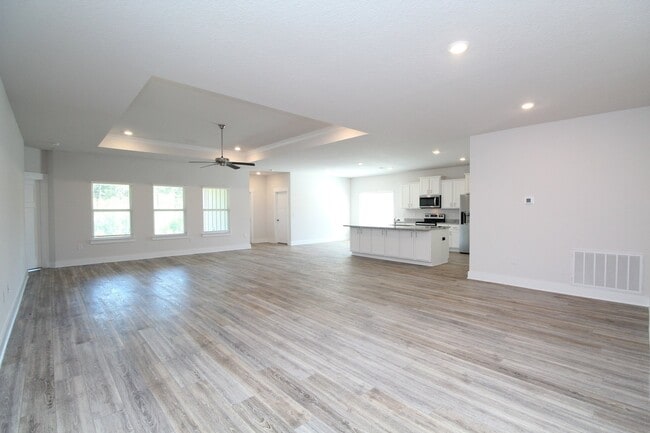 Building Photo - Don’t Miss This 4BR Home — 3-Car Garage, Modern Interior, Open Layout & Community Pool in Prime 9...