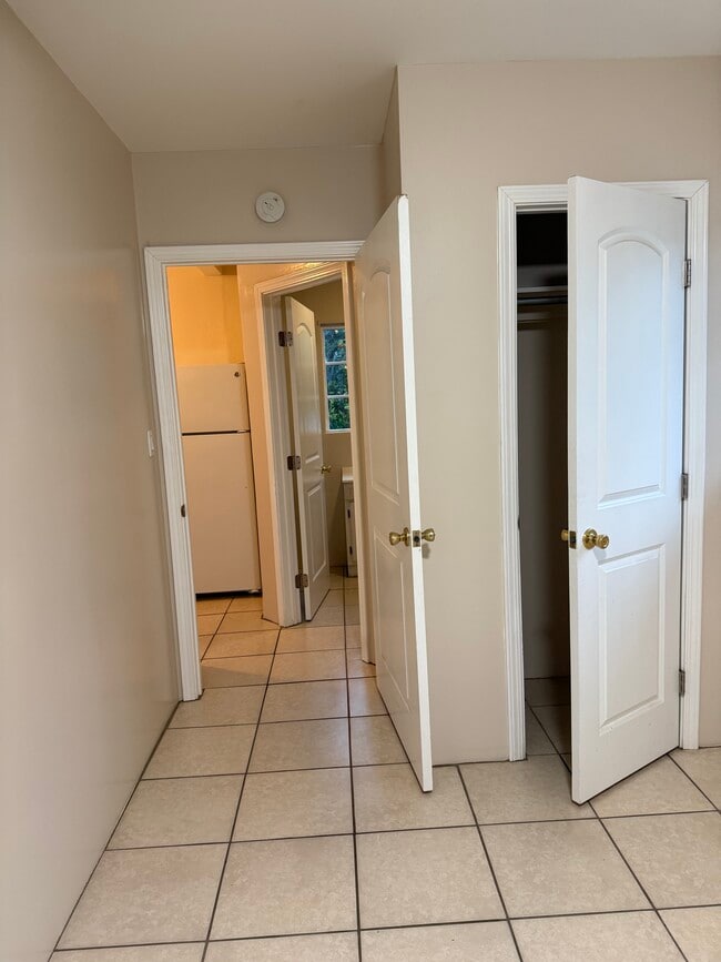 Inside bedroom looking into kitchen. Bedroom closet. - 17526 Horace St