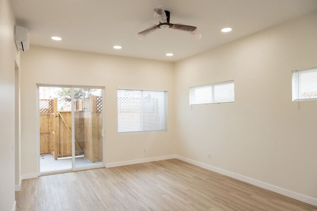 View of living room looking out to private patio - 4772 Bancroft St