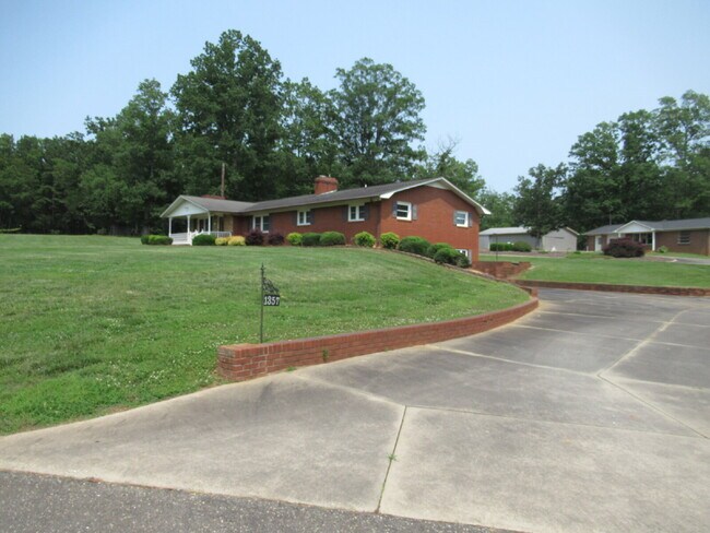 Building Photo - Charming All-Brick Ranch with Finished Bas...