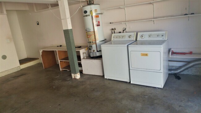 laundry washer and dryer in garage - 823 Coriander Dr