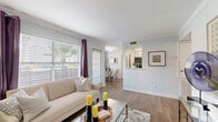 Located at 11700 Fuqua St in Houston, TX, this single-story 2-bedroom, 3-bathroom home offers a well-organized layout designed for comfortable everyday living. The entryway welcomes guests with crown molding, wood-look flooring, and clean white walls that carry throughout the main living areas.

The open-concept living room is bright and inviting, featuring large windows with plantation blinds that allow abundant natural light and views of the surrounding greenery. It flows seamlessly into the dining area, creating a cohesive space ideal for both relaxing and entertaining.

The kitchen is efficiently designed with white cabinetry, a dual-basin stainless steel sink, a grey subway tile backsplash, and black stainless appliances including a range and microwave. A pass-through window connects the kitchen to the dining area, enhancing the open feel.

Both bedrooms are comfortably sized, each featuring ceiling fans with light fixtures, closets, and windows dressed with blinds and curtain panels. The primary bedroom includes additional storage space. Three full bathrooms serve the home, each finished with wood-look flooring and a shower-tub combination.

Additional highlights include a dedicated in-unit laundry area, a hallway for added flow, two closets for ample storage, and a private patio for outdoor enjoyment.