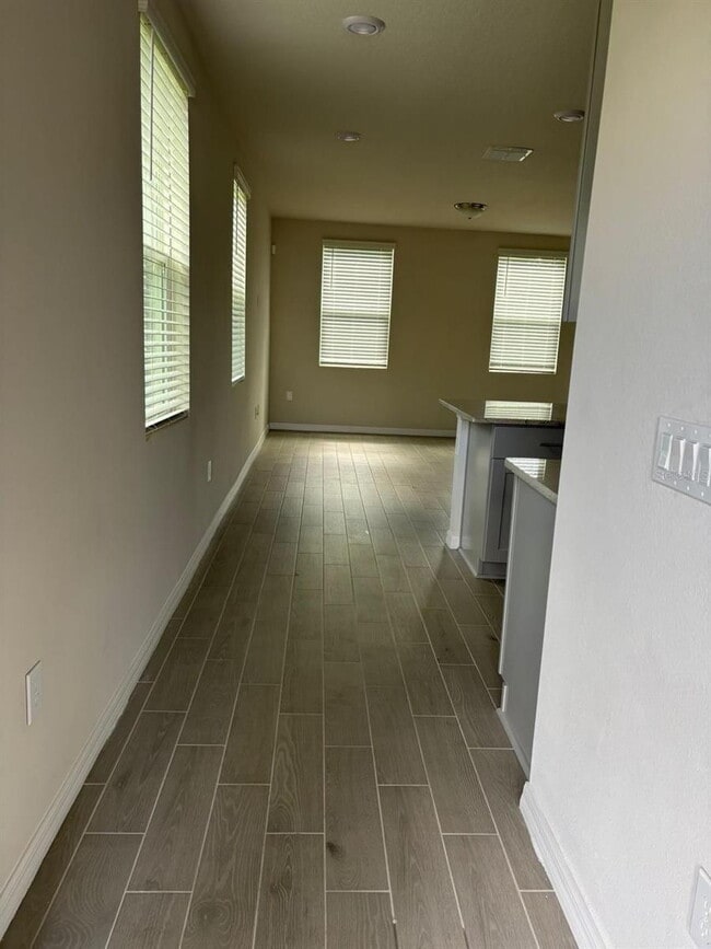 Building Photo - This beautiful townhouse features an abundance of space and natural light.