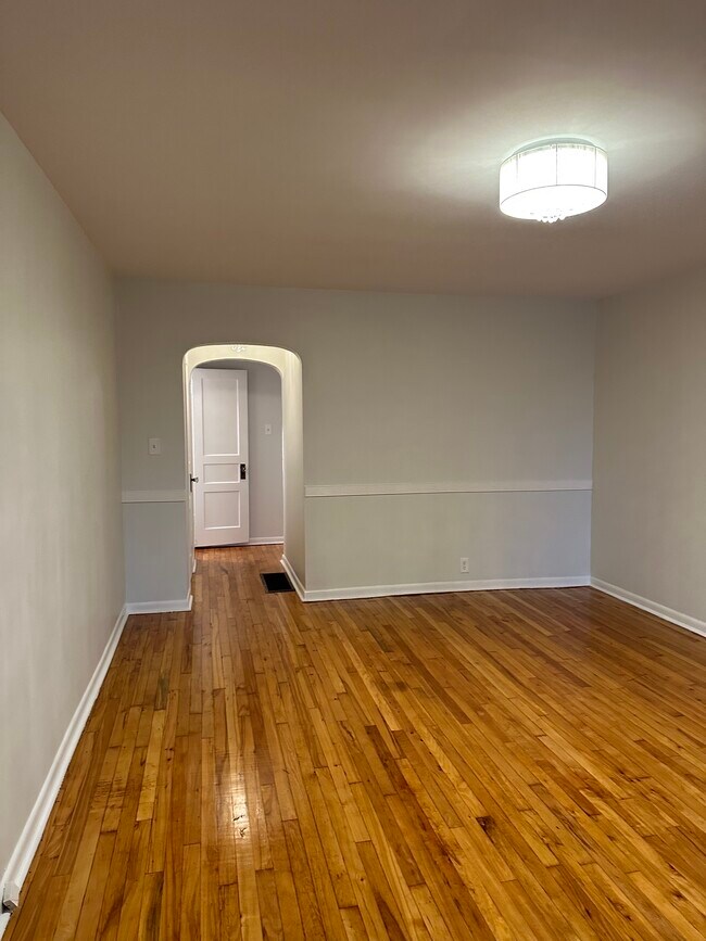 Hardwood floors, period arches and upgraded lighting welcome you home. - 942 Russell St