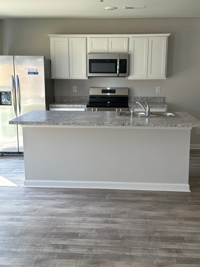 Building Photo - *Rent FREE until May1!*  Three Bedroom | Two and a Half Bath Townhome
