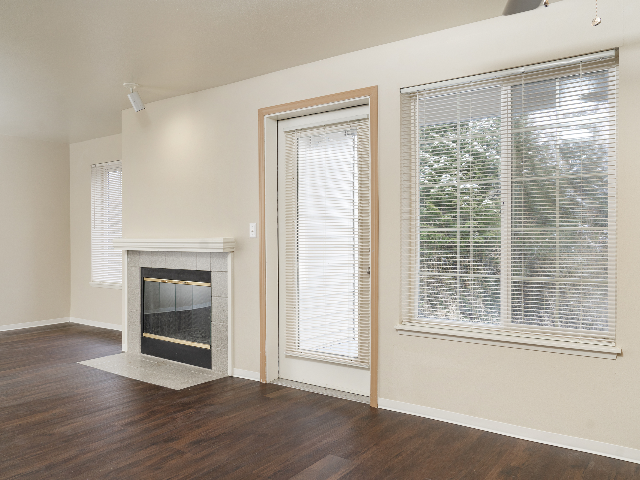 Mahogany Style Plank Floors in Living Room l Canyon Park l Luxury Remodeled Apartments in Puyallup Canyon Park l Luxury Remodeled Apartments in Puyallup - Canyon Park Apartments