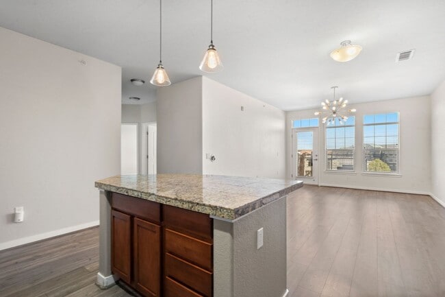 Building Photo - Charming 2 Bed, 2 Bath Top-Floor Condo with Great Sunrise Views