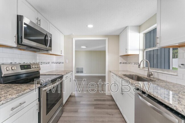 Building Photo - 6121 N Falkenburg Rd