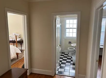 Downstairs hallway; full bathroom and two bedrooms - 207 Edgedale Dr