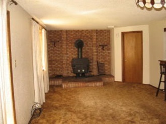 Living Room - door to laundry - 8770 Chipita Park Rd