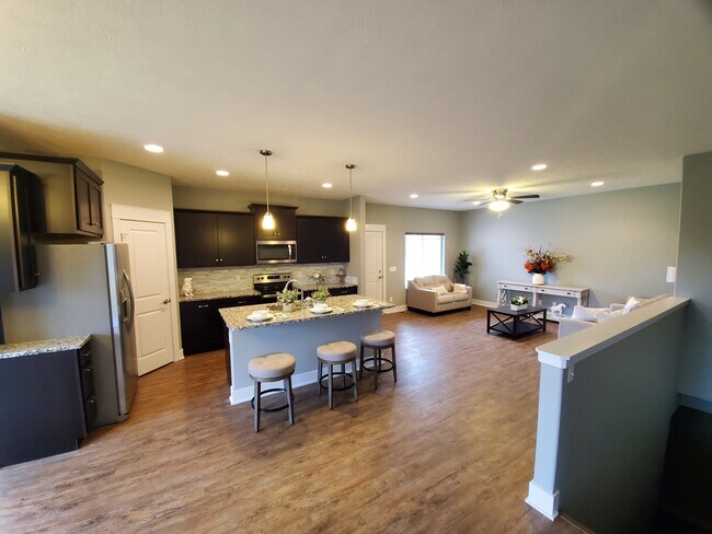 Open living room, kitchen, and dining - 7927 Maxine Drive