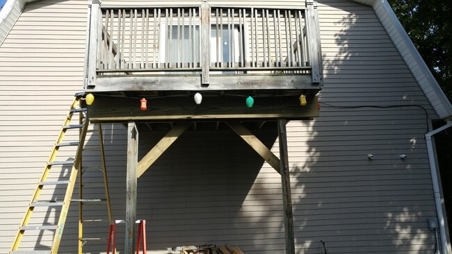 Private deck looking out over the partially fenced in backyard - 407 3rd St