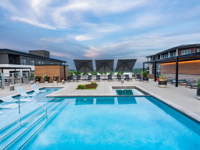 Resort-style rooftop pool with views and plenty of space to unwind or connect. - Modera West Wash Park