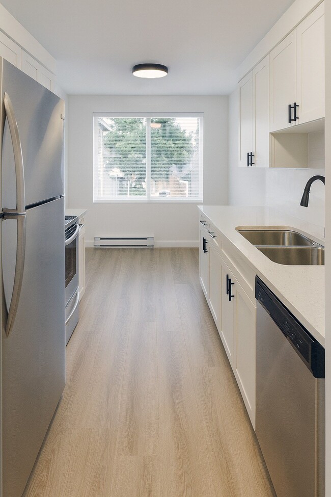 Cocina y comedor - Heritage Woods Apartments