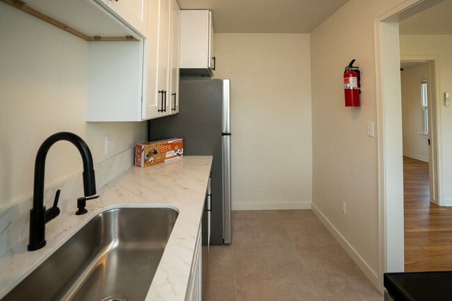 Building Photo - Step into timeless elegance and modern com...