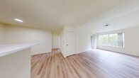 Located at 630 S Peck Dr in Longmont, Boulder County, Colorado, this one-bedroom, one-bathroom unit offers a practical and well-organized layout across a single floor. The living area is bright and open, featuring light wood-style flooring throughout and crisp white walls that create a clean, airy atmosphere. Large windows allow abundant natural light to fill the space, with greenery visible from outside adding a pleasant outdoor connection.

The kitchen is efficiently designed with warm oak-toned cabinetry, white laminate countertops, a double stainless steel sink, and white appliances including a refrigerator and dishwasher. A breakfast bar peninsula connects the kitchen to the living area, enhancing the open flow of the space. Recessed lighting keeps the kitchen well-illuminated.

The bedroom is a comfortable size, featuring plush carpeting, vaulted ceilings, and a window that frames lush outdoor views. A closet with louvered doors provides convenient storage. The full bathroom includes a wood-tone vanity with a white countertop, a lighted mirror cabinet, a bathtub/shower combination, and light wood-style flooring. The unit also includes a dedicated closet space for additional storage needs.