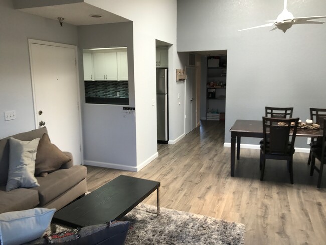 View into dining area, kitchen and hallway from living room - 55 Stenner St