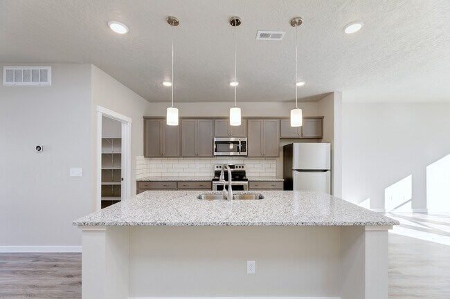 2nd Floor - Kitchen with granite countertops and island - 3143 N Network Ln