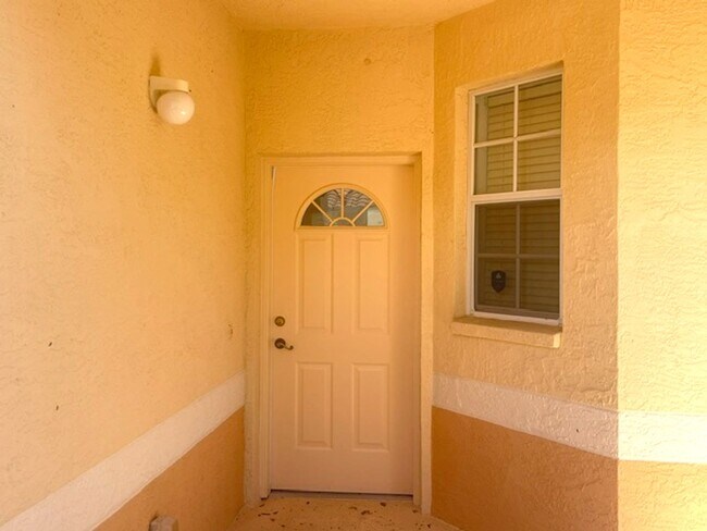Building Photo - Elegant 3 Bedroom End-Unit Condo with Screened Lanai & Pond Views and A Private Garage