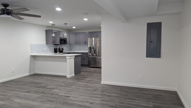 View from the front door looking into the kitchen. - 2118 N Wallflower Dr