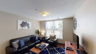Located at 195 E McMillan St in Cincinnati, Ohio, this single-floor residential unit offers a well-organized layout designed to accommodate multiple occupants comfortably. The living room serves as the communal hub of the space, featuring hardwood-style flooring, a textured ceiling, and a large window that brings in generous natural light and views of the surrounding neighborhood. The room provides ample space for seating and relaxation, creating an inviting shared environment.

The kitchen is efficiently designed with light-toned cabinetry, dark granite-style countertops, and white appliances including a range and over-the-range microwave. Hardwood-style flooring continues through this area, and the layout allows for practical day-to-day use.

Multiple private bedrooms are found throughout the unit, each carpeted and outfitted with a window for natural light and outdoor views. The bedrooms offer enough space for a bed and a dedicated study or work area, making them well-suited for student living. The bathroom includes a full tub-shower combination in a clean, straightforward layout.

The floorplan, as seen in the dollhouse view, reveals a logical and connected arrangement of shared and private spaces, making this unit a practical option for those seeking housing near the University of Cincinnati and Xavier University corridors.