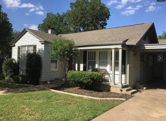 Front of home (before red mulch). - 214 S Bishop St