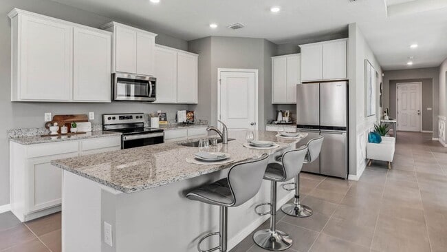 Building Photo - EXCEPTIONAL HOME IN BELLA LAGO PARRISH ! 4...