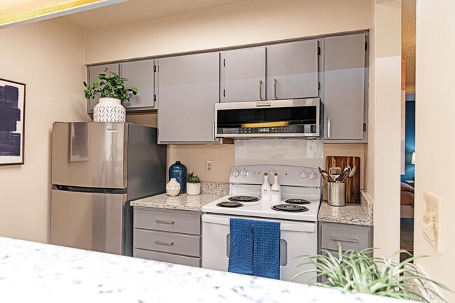 Kitchen with granite counters and modern cabinetry - The Manning