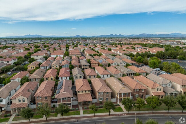 Mountains peek out from behind rows of townhomes in Gilbert.