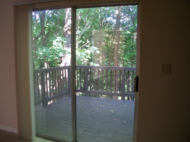 Step out onto the deck from the kitchen. - 206 Chateau Ln