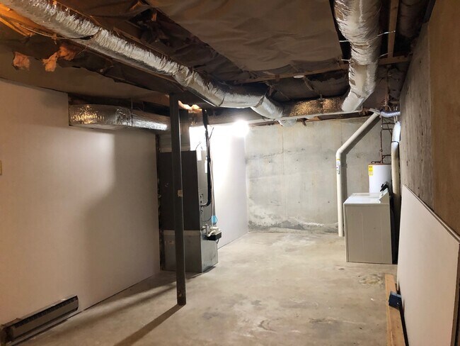Washer and dryer and storage area in lower level - 715 Riverland Rd SE