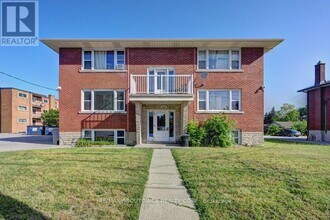 Building Photo - 1230 Queen's Blvd