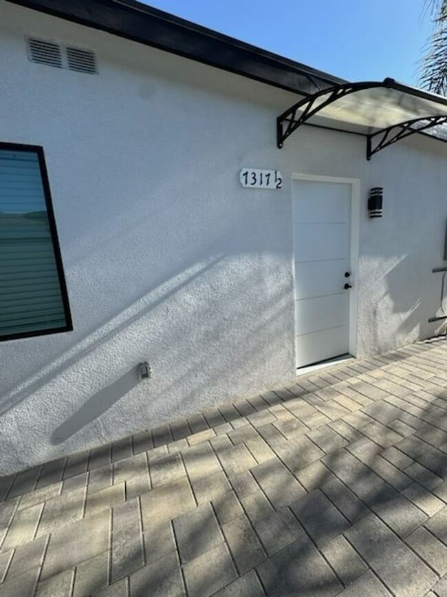 Building Photo - 7317-7321 Garden Grove Ave