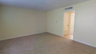 Located at 937 Denton Blvd in Fort Walton Beach, Florida, this two-story property offers a straightforward and practical layout suited for comfortable everyday living. The interior features a neutral color palette throughout, with soft beige walls and white trim that create a bright, clean atmosphere across the living spaces.

The carpeted rooms provide a warm and cushioned underfoot feel, while tiled flooring in the transitional and ancillary areas adds durability and ease of maintenance. Ceiling-mounted HVAC vents are present throughout, ensuring efficient climate control across both floors — a practical feature well-suited to the Florida climate.

The rooms are generously proportioned, with standard ceiling heights that contribute to an open, uncluttered feel. The use of consistent finishes and neutral tones throughout the space allows for versatile interior decorating possibilities. Natural light filters into the rooms, contributing to the overall bright and airy ambiance.

Spanning two floors, the property offers a clear separation between living and private spaces, adding a functional dimension to the home's overall layout. The understated design choices keep the focus on livability, making this Fort Walton Beach property a practical and adaptable space.