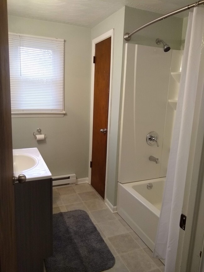 Bathroom all new fixtures and floor. - 236 Hartford St