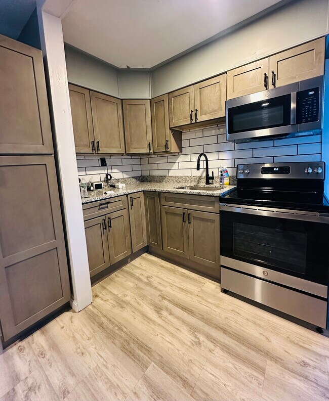 Kitchen With Counter & Cabinets - 69 Winchester St