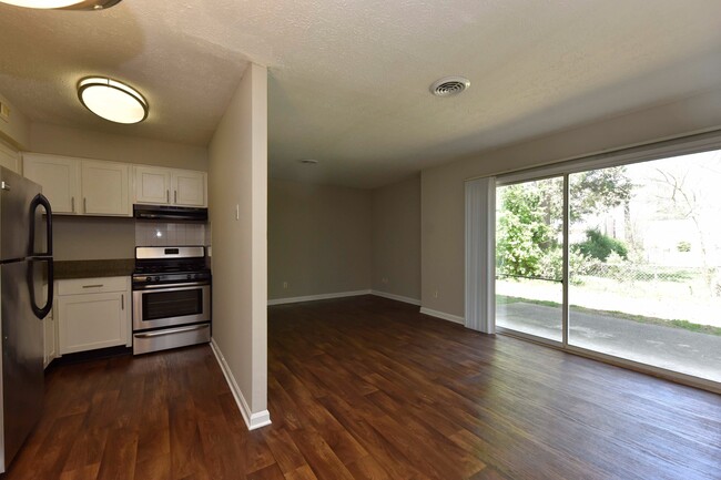 Living Room with Hardwood Style Flooring - The Enclave