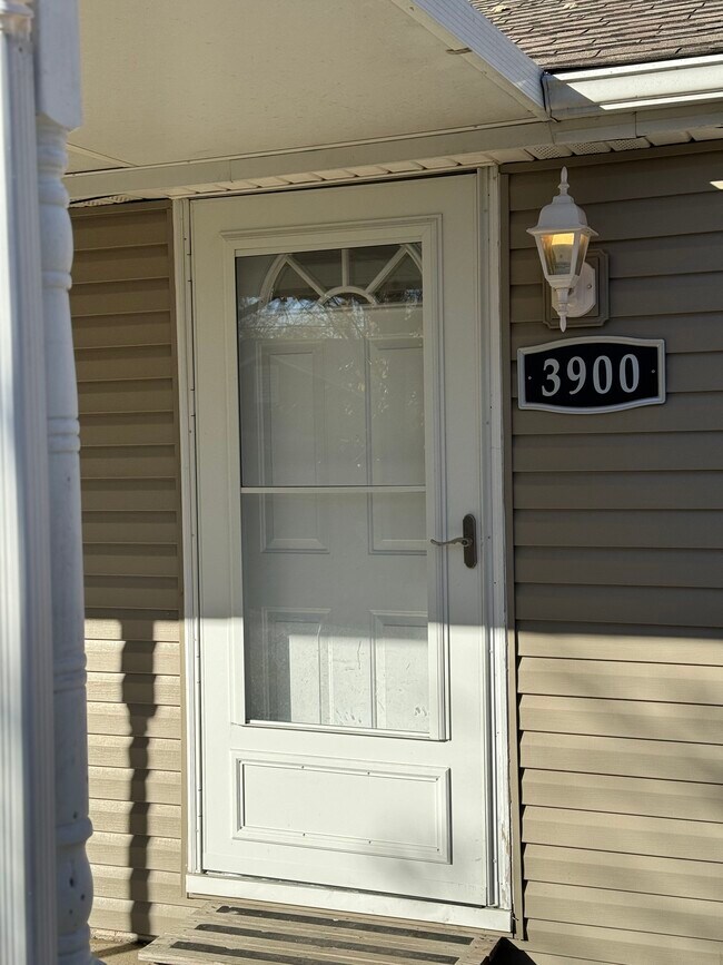 Coverd Porch & Storm Door - 3900 W 11th St