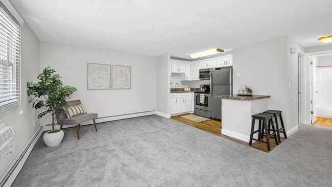 Designed with comfort and convenience in mind, this open-concept living space provides plenty of room to relax, entertain, and personalize your home. - Edgewood Court