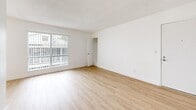 Located at 203 Laurel Ave in National City, CA, this single-story 2-bedroom, 1-bathroom home offers a clean, modern interior with a cohesive design throughout. Light-toned wood-style flooring runs seamlessly across all rooms, complemented by crisp white walls and white baseboards that create a bright, airy atmosphere. Textured ceilings add a classic touch to each space.

The living room provides an open, spacious feel with ample room for a variety of furniture arrangements, while the adjacent dining area flows naturally into the layout. The kitchen features white shaker-style cabinetry with brushed nickel hardware, white quartz countertops, and includes a refrigerator — offering a clean, functional workspace.

Both bedrooms are well-proportioned and filled with natural light through windows fitted with vertical blinds. The primary bedroom includes a closet and generous floor area, while the second bedroom offers a similar bright and open feel with outdoor views.

The bathroom is finished in an all-white palette, featuring a tub-shower combo with a curved curtain rod, a white vanity with an integrated sink, and brushed nickel fixtures. Every room reflects a consistent, freshly updated aesthetic, making this a move-in ready home.
