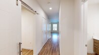 Step into your future and unlock the potential of this exquisite 520 sq ft apartment at 5210 Curie Dr, Bowie. This thoughtfully designed space is your canvas for creating the life you've always imagined. The heart of this home is the stunning kitchen, where culinary dreams come to life. Gleaming stainless steel appliances, including a spacious refrigerator and built-in microwave, complement the warm wooden cabinetry and elegant granite countertops. The kitchen island doubles as a breakfast bar, perfect for casual dining or entertaining friends.

The living area flows seamlessly from the kitchen, creating an open-concept space that maximizes every square foot. Large windows flood the room with natural light, enhancing the sense of spaciousness and warmth. The bedroom offers a tranquil retreat, with ample space for a queen-sized bed and additional furnishings. The bathroom is a model of modern efficiency, featuring a sleek vanity, crisp white fixtures, and a combination shower/tub for versatility.

Throughout the apartment, beautiful wood-look flooring adds a touch of sophistication and warmth. The neutral color palette provides a blank canvas for your personal style to shine. With its prime location in Bowie, MD, this home puts you at the center of it all. Whether you're a young professional, a couple starting out, or someone looking to simplify without sacrificing style, this apartment offers the perfect blend of comfort, convenience, and contemporary living. Your journey to an inspired lifestyle starts here – make this space your own and watch your aspirations become reality.