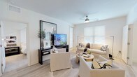Located at 151 Du Rhu Dr in Mobile, Alabama, this single-floor residence offers a clean, contemporary design throughout. The open living area is bright and welcoming, featuring light wood-look flooring, crisp white walls, and generous natural light streaming through large windows dressed with white blinds. A ceiling fan adds comfort, and the space is well-proportioned for both relaxing and entertaining.

The kitchen is thoughtfully designed with white shaker cabinetry, white countertops, stainless steel appliances including a range, built-in microwave, dishwasher, and refrigerator, complemented by track lighting and light wood-look flooring.

The bedrooms are serene and well-lit, each featuring ceiling fans, plush carpeting or light flooring, and windows that allow ample natural light. One bedroom includes a four-poster-style bed frame, adding a refined touch to the restful atmosphere.

Two bathrooms provide functionality and style. The primary bath features a dual-sink vanity with white countertops, a glass-door shower, and light wood-look flooring. The secondary bath includes a single vanity with generous cabinetry and a separate toilet and shower area.

Additional highlights include a spacious walk-in closet with wire shelving on multiple walls, offering excellent storage capacity. Throughout the home, the neutral palette and modern finishes create a cohesive, move-in ready environment.