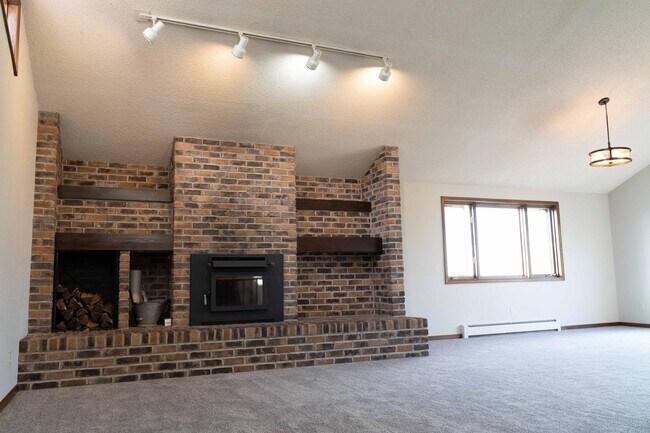 Great room with vaulted ceilings and fireplace - 153 Skyline Dr.