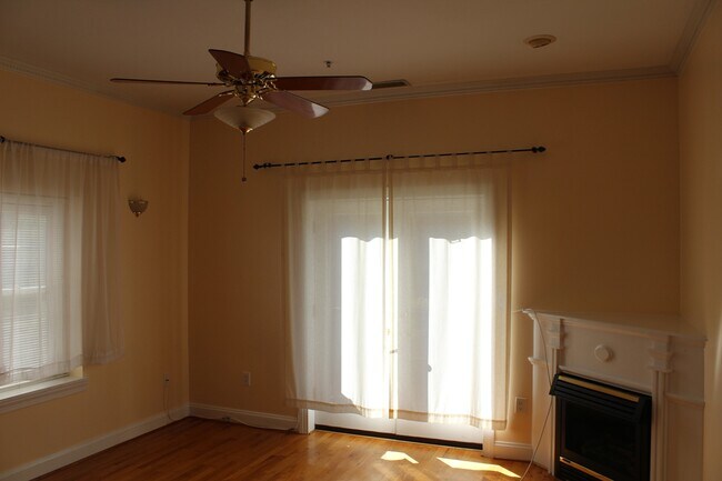 Living room w/ ceiling fan and fireplace - 1704 16th St NW