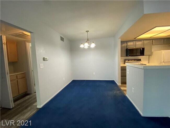 Building Photo - Cozy 1-Bed Condo in Gated 89128 Community ...