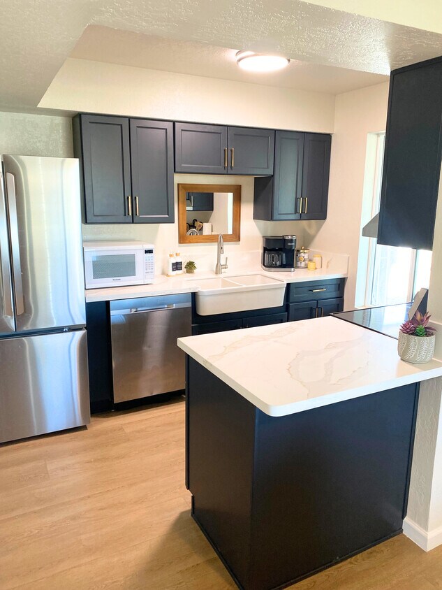 Kitchen with new cabinets, countertops, appliances. ***Additional photos are on the way! We're cu - 1795 W 28th St