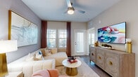 Located in Rockledge, FL, this well-appointed 2-bedroom, 2-bathroom residence offers a thoughtfully designed single-level layout. The open-concept kitchen is a standout, showcasing white shaker cabinetry, quartz countertops, a subway tile backsplash, stainless steel appliances including a range, microwave, dishwasher, and refrigerator, along with a central island with bar seating and pendant lighting. Wood-look plank flooring flows seamlessly throughout the living areas and bedrooms, creating a cohesive aesthetic.

The generously sized primary bedroom features a ceiling fan, large windows with natural light, and access to a walk-in closet with built-in wire shelving. Its en-suite bathroom is equipped with a dual-sink vanity, a glass-enclosed shower, and wood-look tile flooring. The second bedroom is equally comfortable, with a ceiling fan and ample closet space. The second bathroom offers a single vanity and a shower-tub combination.

A dedicated dining area complements the living space, while a private balcony provides an inviting outdoor retreat. The overall design balances modern finishes with a warm, neutral palette, creating a clean and functional living environment.