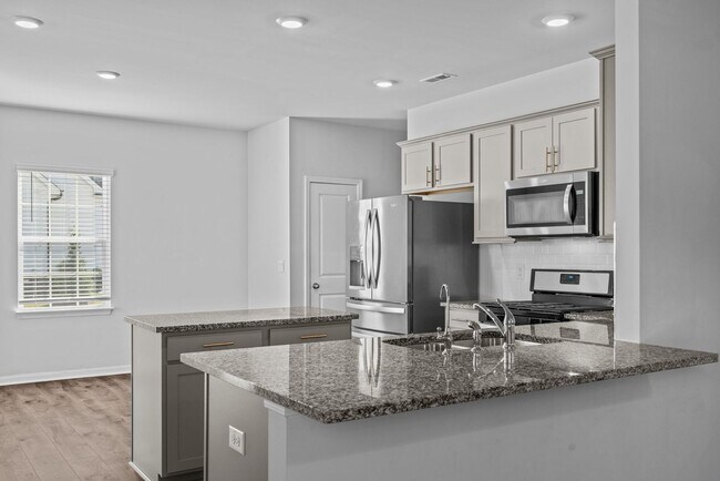 Building Photo - 4-bedroom, 2.5-bathroom home located in th...